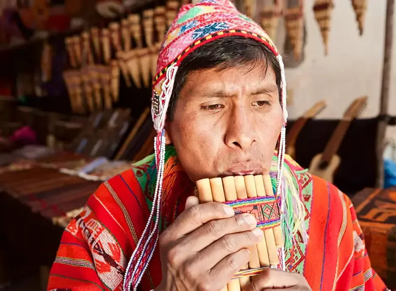 Portrait Of Peruvian Man Playing A Zampoña, Sacred Valley, Peru
