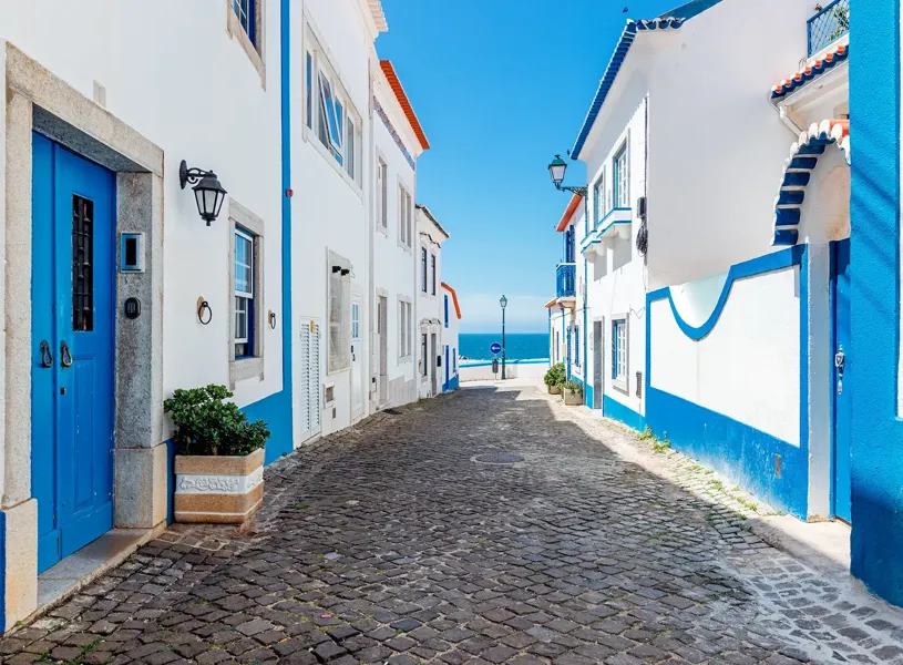 Ericeira village with whitewashed houses on a sunny day, Portugal