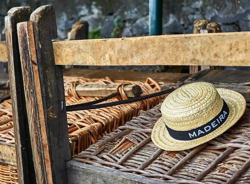 Straw hat on a toboggan in Madeira