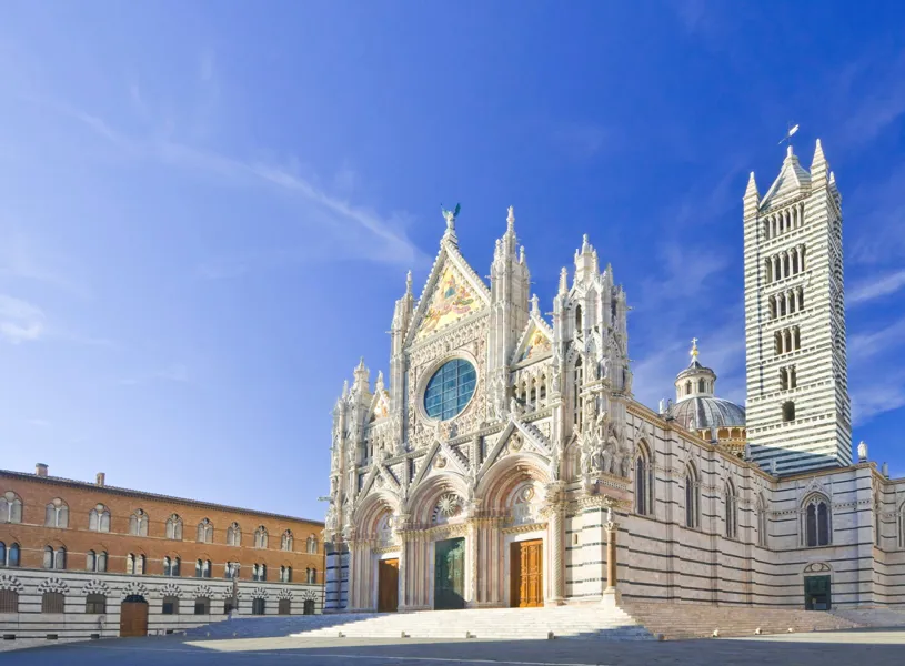 Medieval Siena Cathedral facade ona sunny day, Siena, Italy