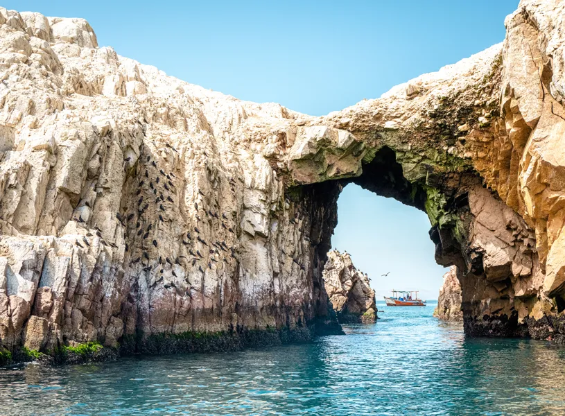 Scenic shot of a rock archway in the Ballestas Islands, Peru